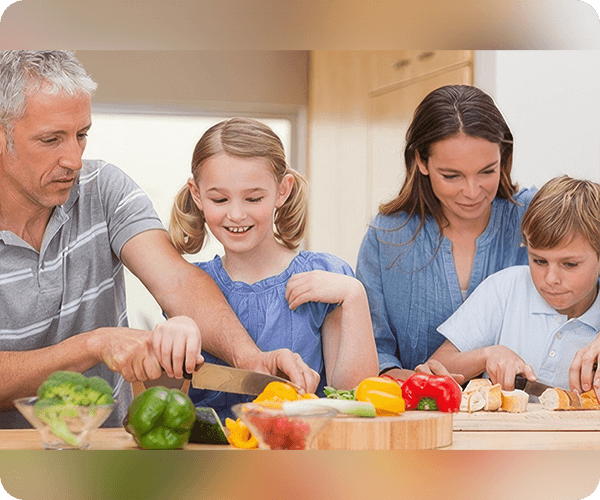 A family is preparing food together in the kitchen.