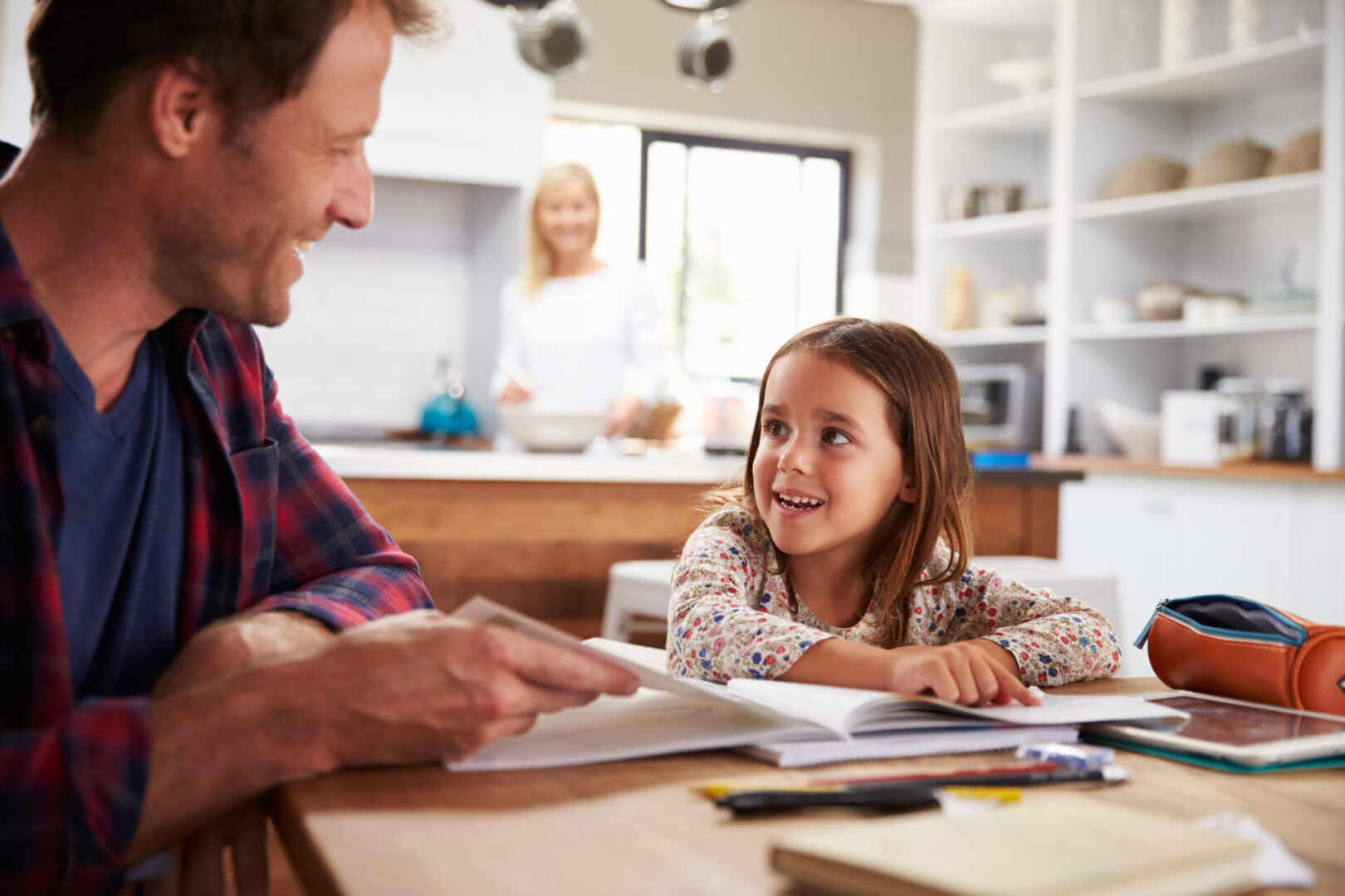 Father home schooling his young daughter Father home schooling his young daughter